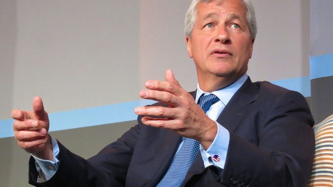 Jamie Dimon, head of JP Morgan, has criticised US tax policy for failing to growth jobs and wages.