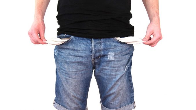 A man with empty pockets symbolises the problem of profiteering utility companies in the UK.